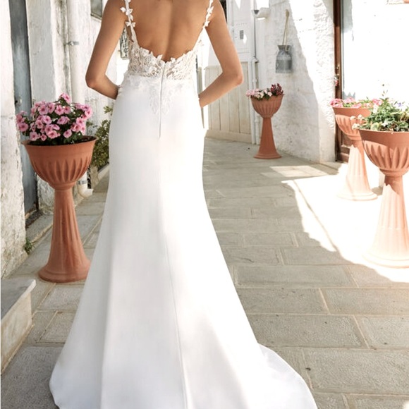 Never worn or altered wedding dress, size 12 but fits a size 4 jeans well. - Picture 3 of 6